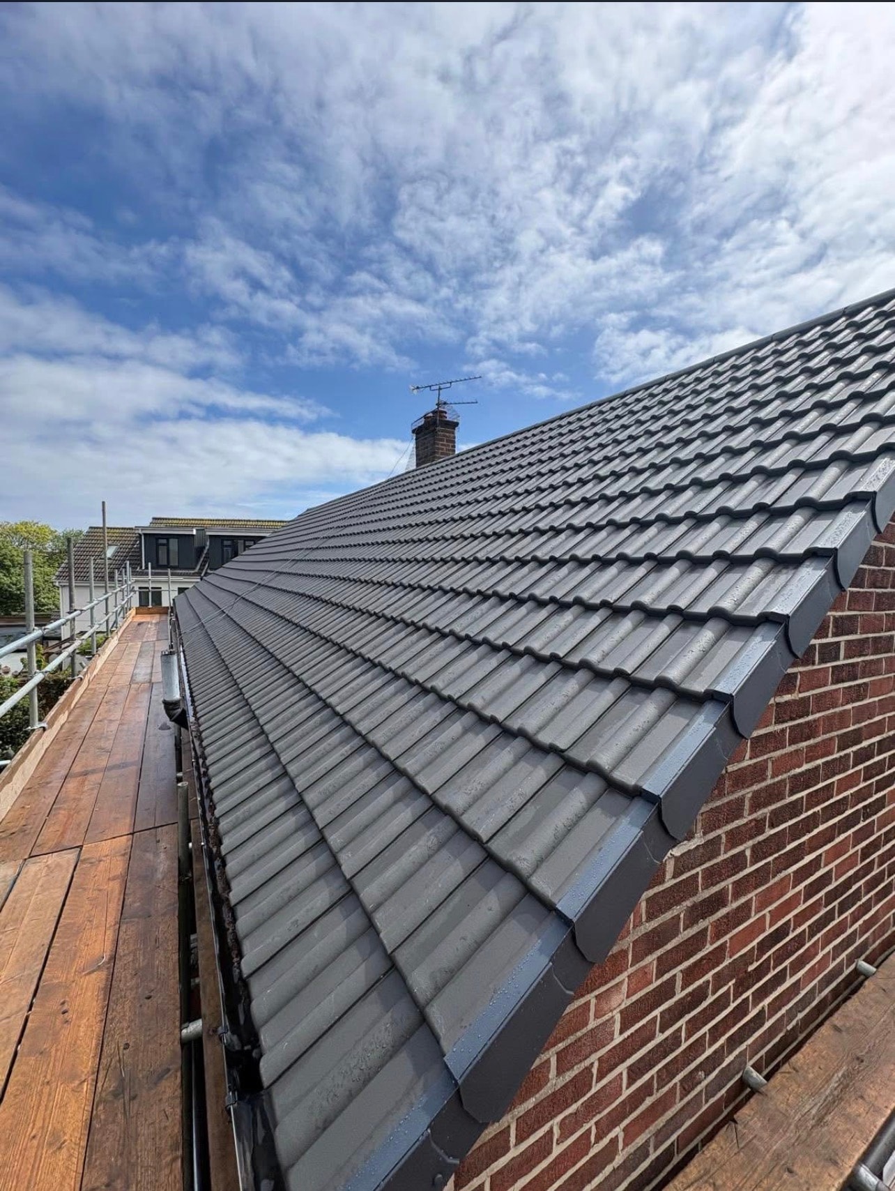 Grey Double Roman Tile Roof Installation