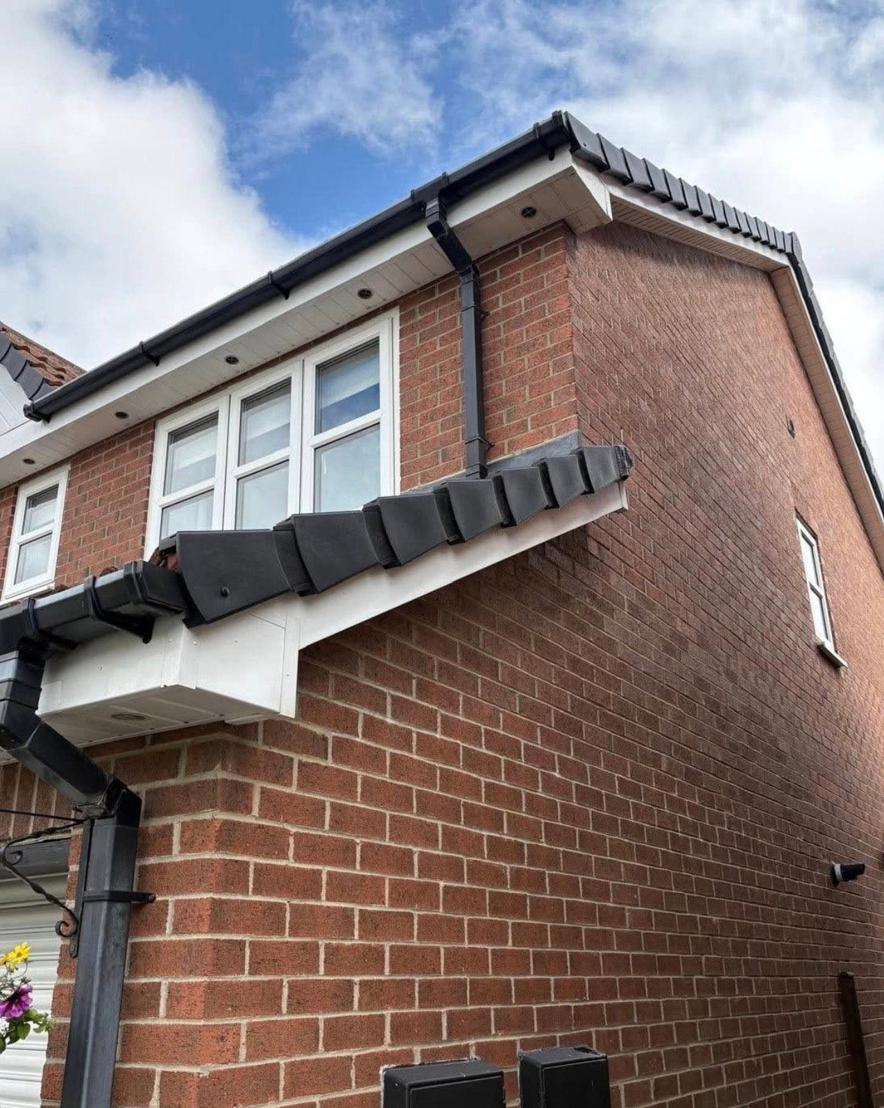 Guttering installation on a house exterior